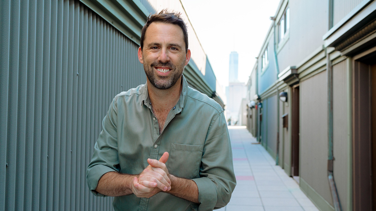 Tim Simons in a green shirt